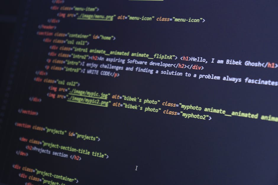 A silver laptop with a black keyboard is placed on a wooden table, displaying lines of code on its bright screen. The laptop's screen is illuminated, contrasting with the softly blurred background tha